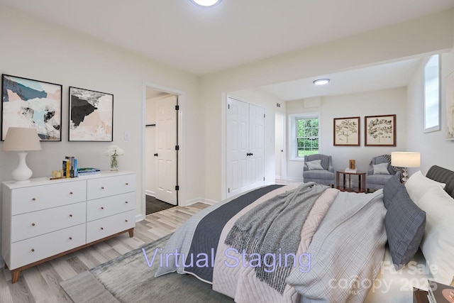 1224 E Woodlawn Rd, Charlotte, NC 28209 - bedroom featuring light wood-style floors and a closet