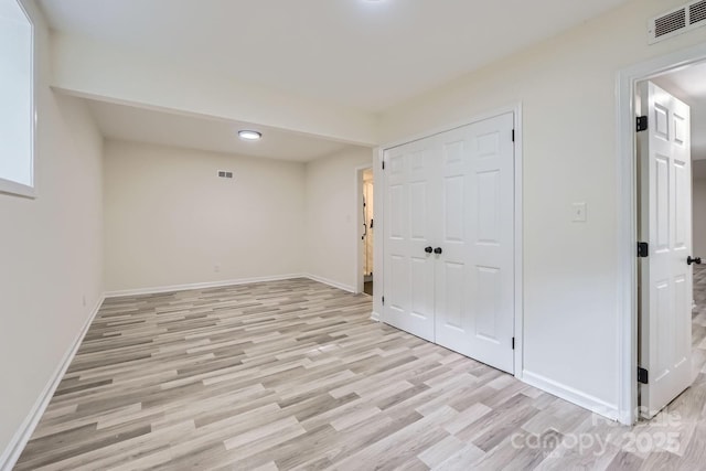 1224 E Woodlawn Rd, Charlotte, NC 28209 - basement with light wood-type flooring and recessed lighting