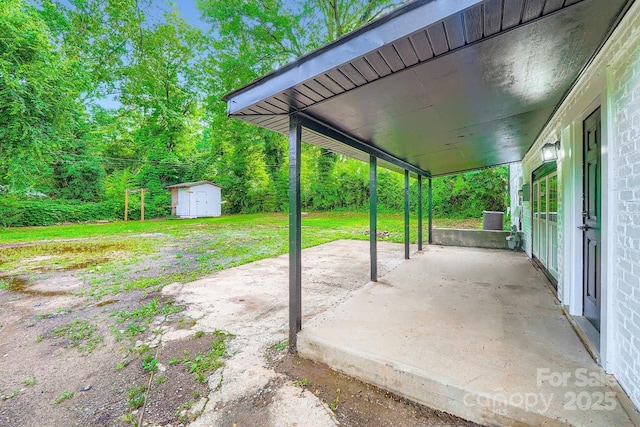 1224 E Woodlawn Rd, Charlotte, NC 28209 - view of patio featuring a shed and a carport