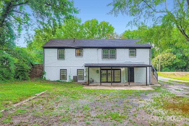 1224 E Woodlawn Rd, Charlotte, NC 28209 - back of house featuring a patio area and brick siding