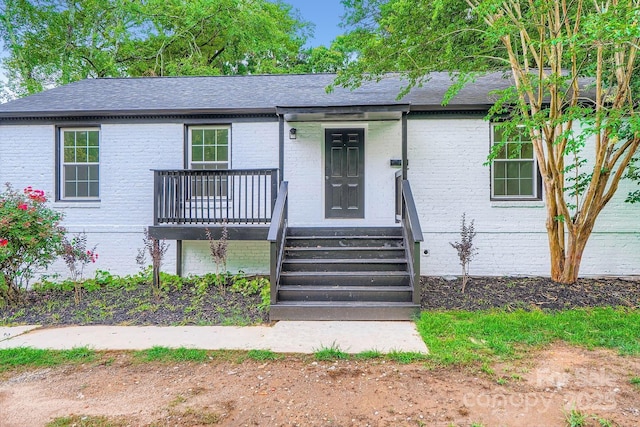 1224 E Woodlawn Rd, Charlotte, NC 28209 - ranch-style house with brick siding and roof with shingles