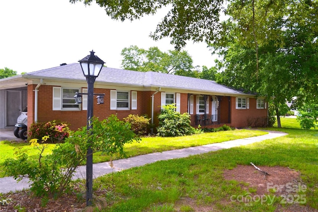 405 Wesley Heights Dr, Albemarle, NC 28001 - ranch-style home with brick siding and a front yard