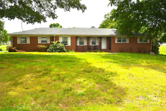 405 Wesley Heights Dr, Albemarle, NC 28001 - ranch-style home with a front lawn and brick siding