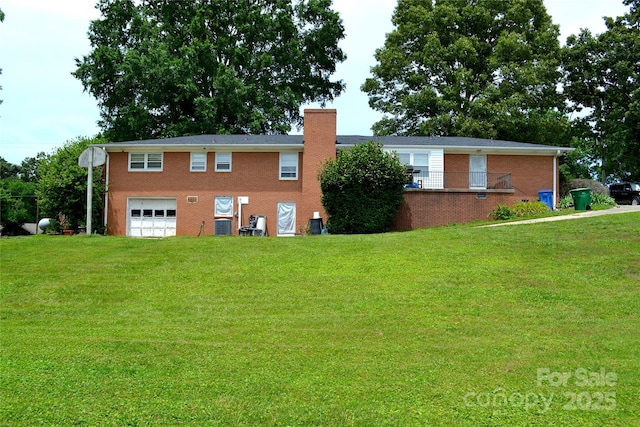 405 Wesley Heights Dr, Albemarle, NC 28001 - view of front of home with an attached garage, brick siding, a chimney, and a front yard
