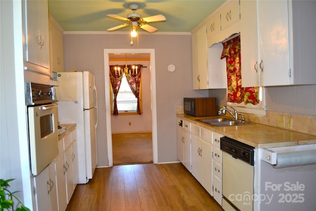 405 Wesley Heights Dr, Albemarle, NC 28001 - kitchen featuring white appliances, light countertops, a chandelier, crown molding, and a ceiling fan