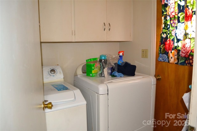 405 Wesley Heights Dr, Albemarle, NC 28001 - laundry area featuring washing machine and dryer and cabinet space