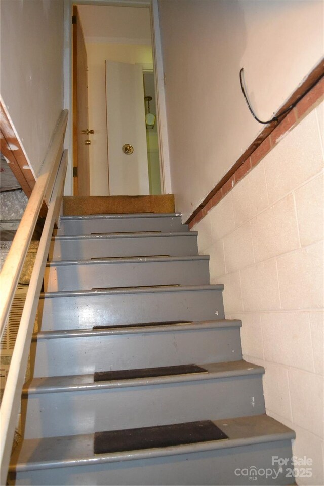 405 Wesley Heights Dr, Albemarle, NC 28001 - staircase with concrete block wall