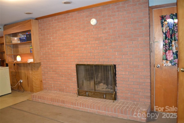 405 Wesley Heights Dr, Albemarle, NC 28001 - detailed view of a brick fireplace, washer / dryer, ornamental molding, and brick wall