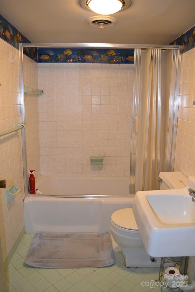405 Wesley Heights Dr, Albemarle, NC 28001 - full bath with tile walls, tile patterned flooring, and bathing tub / shower combination