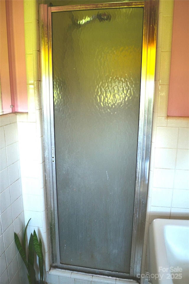 405 Wesley Heights Dr, Albemarle, NC 28001 - bathroom view of tile walls and a stall shower