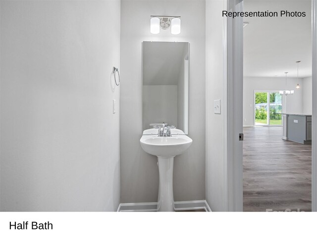 217 Lake George Dr, Shelby, NC 28152 - bathroom with wood finished floors and a chandelier