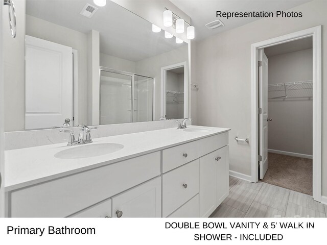 217 Lake George Dr, Shelby, NC 28152 - bathroom with a spacious closet, double vanity, and a stall shower