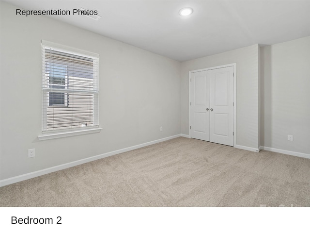 217 Lake George Dr, Shelby, NC 28152 - unfurnished bedroom featuring carpet, a closet, and recessed lighting