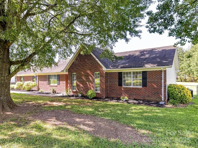 5105 Hampton Meadows Rd, Monroe, NC 28110 - single story home featuring brick siding, a front yard, and roof with shingles
