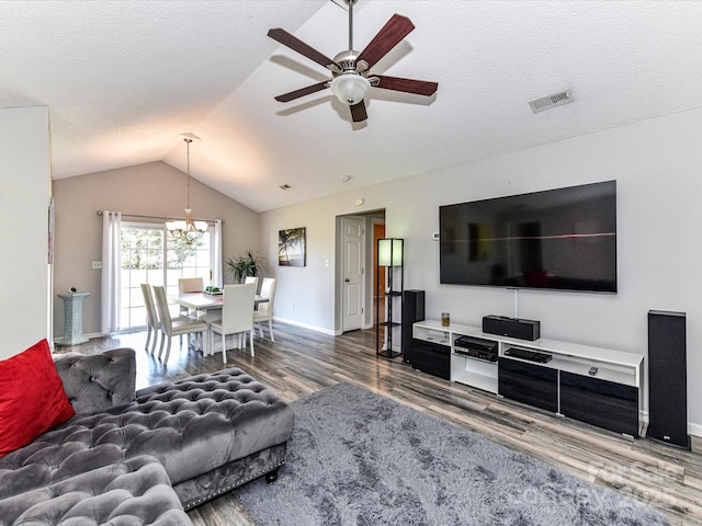 5105 Hampton Meadows Rd, Monroe, NC 28110 - living room with wood finished floors, ceiling fan, vaulted ceiling, a chandelier, and a textured ceiling