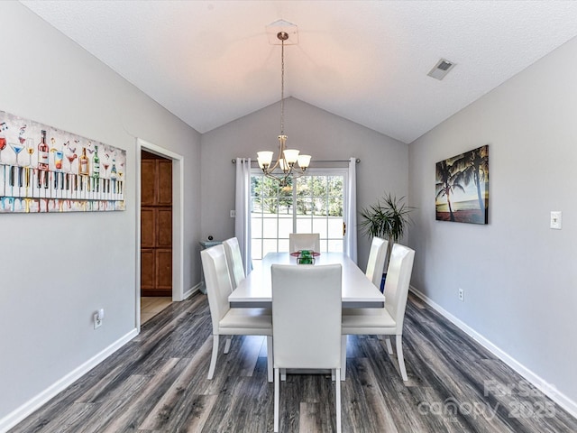 5105 Hampton Meadows Rd, Monroe, NC 28110 - dining area featuring dark wood finished floors, a chandelier, and lofted ceiling