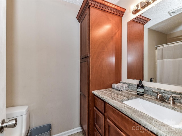 5105 Hampton Meadows Rd, Monroe, NC 28110 - bathroom featuring vanity and a textured ceiling