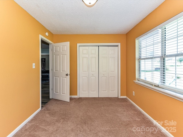 5105 Hampton Meadows Rd, Monroe, NC 28110 - unfurnished bedroom featuring a textured ceiling, a closet, and carpet floors