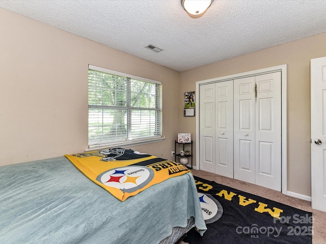 5105 Hampton Meadows Rd, Monroe, NC 28110 - carpeted bedroom featuring a closet and a textured ceiling