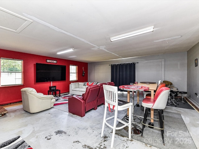5105 Hampton Meadows Rd, Monroe, NC 28110 - living area with unfinished concrete flooring and plenty of natural light