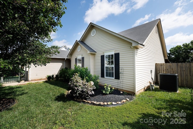 5806 Autumn Trace Ln, Indian Trail, NC 28079 - view of side of property featuring a central air condition unit and roof with shingles
