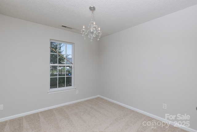 5806 Autumn Trace Ln, Indian Trail, NC 28079 - carpeted spare room featuring a chandelier and a textured ceiling