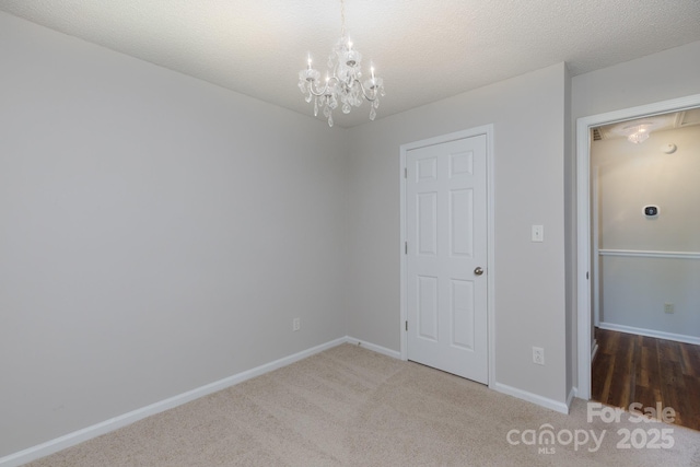 5806 Autumn Trace Ln, Indian Trail, NC 28079 - unfurnished bedroom featuring a chandelier and carpet flooring