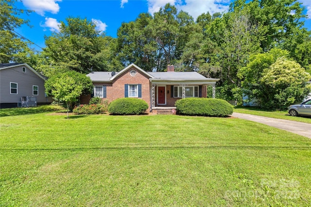 506 Gold St, Shelby, NC 28150 - view of front of house featuring brick siding, a chimney, a front yard, and a porch