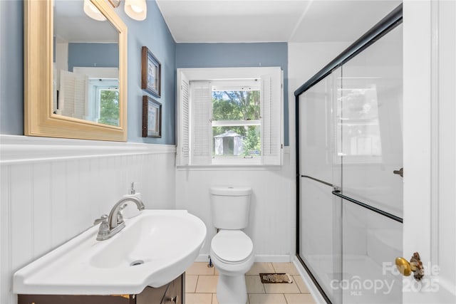 506 Gold St, Shelby, NC 28150 - full bath featuring a shower stall, tile patterned flooring, a wainscoted wall, and vanity