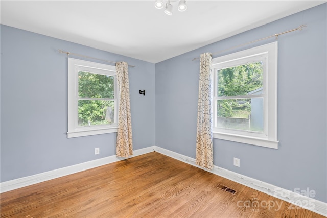 506 Gold St, Shelby, NC 28150 - empty room featuring plenty of natural light and wood finished floors