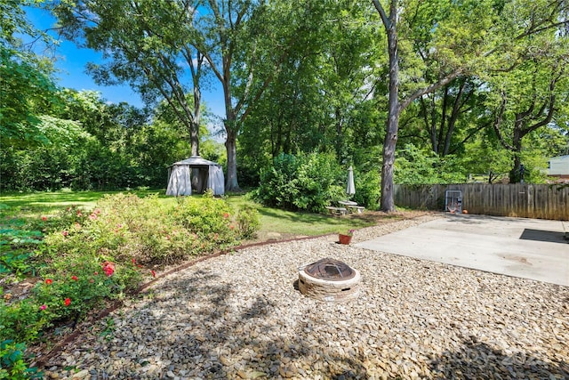 506 Gold St, Shelby, NC 28150 - view of yard featuring an outdoor fire pit, a patio area, and a storage unit