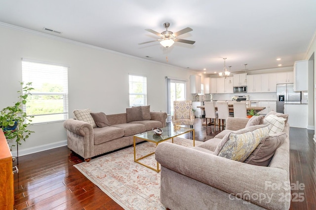 4357 Hornyak Dr, Monroe, NC 28110 - living room featuring crown molding, a chandelier, a ceiling fan, dark wood-style flooring, and recessed lighting