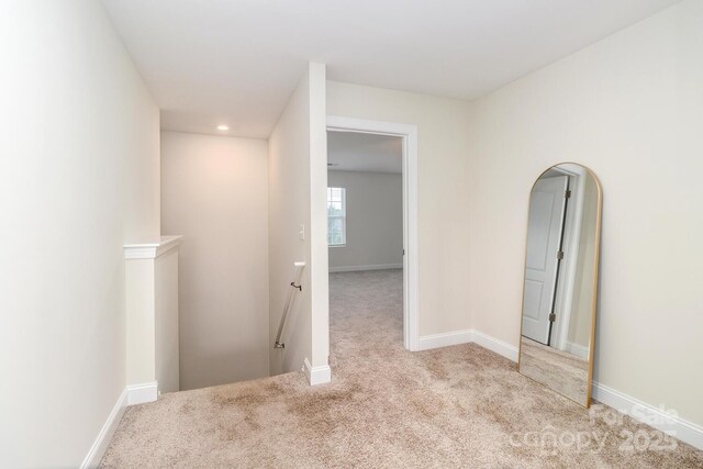 4357 Hornyak Dr, Monroe, NC 28110 - corridor with an upstairs landing, carpet, and arched walkways