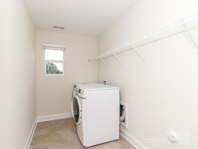 4357 Hornyak Dr, Monroe, NC 28110 - laundry room with washing machine and clothes dryer and baseboards