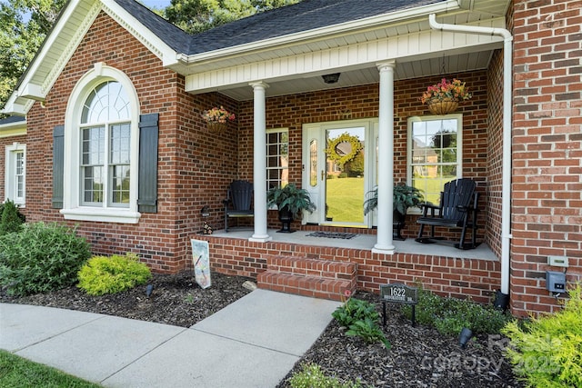 1622 Brookstone Dr, Hickory, NC 28602 - doorway to property featuring covered porch, brick siding, and a shingled roof