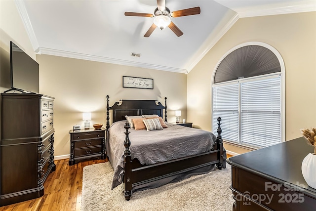 1622 Brookstone Dr, Hickory, NC 28602 - bedroom featuring crown molding, vaulted ceiling, wood finished floors, and a ceiling fan