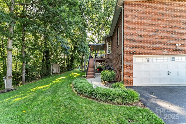 1622 Brookstone Dr, Hickory, NC 28602 - view of property exterior with a shed, stairs, a lawn, and brick siding