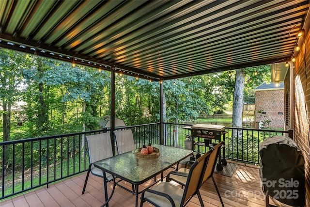 1622 Brookstone Dr, Hickory, NC 28602 - wooden deck with outdoor dining area, a grill, and view of wooded area