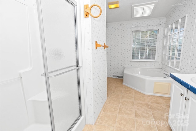 56 Founders Way, Arden, NC 28704 - bathroom featuring wallpapered walls, a shower stall, vanity, a garden tub, and tile patterned floors