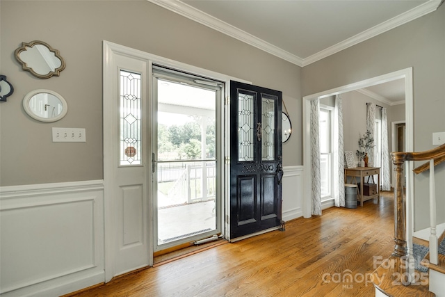 675 Ormand Rd, York, SC 29745 - entryway with stairway, crown molding, light wood-style flooring, a decorative wall, and a wainscoted wall