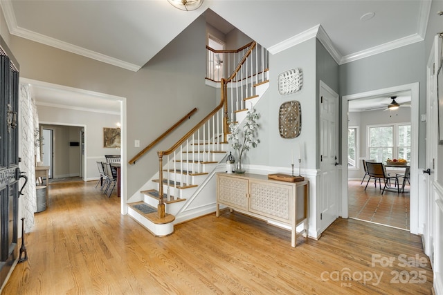 675 Ormand Rd, York, SC 29745 - foyer with stairs, ornamental molding, light wood-style flooring, and ceiling fan