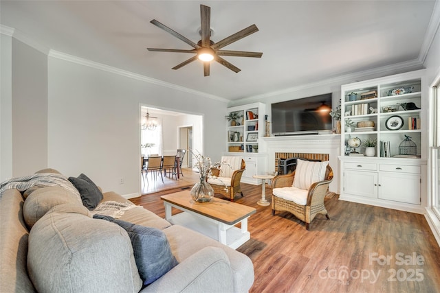 675 Ormand Rd, York, SC 29745 - living area featuring ornamental molding, ceiling fan, wood finished floors, and a brick fireplace