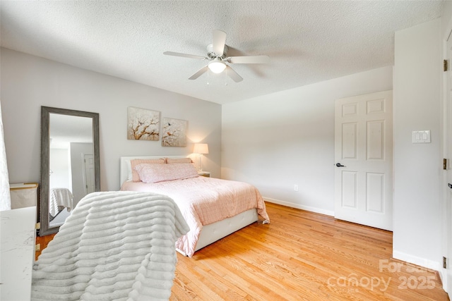 675 Ormand Rd, York, SC 29745 - bedroom with light wood finished floors, a ceiling fan, and a textured ceiling