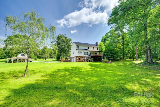 675 Ormand Rd, York, SC 29745 - view of green lawn with stairway, a garage, and a deck