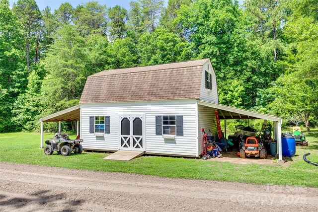 675 Ormand Rd, York, SC 29745 - dutch colonial with a gambrel roof, a shingled roof, an outbuilding, a front lawn, and an attached carport