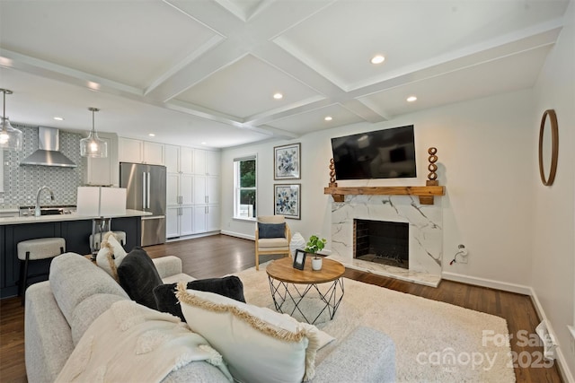 3165 Pendleton Ave, Charlotte, NC 28210 - living area with dark wood-type flooring, a premium fireplace, beam ceiling, recessed lighting, and coffered ceiling