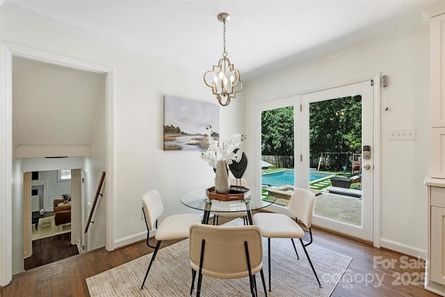 3165 Pendleton Ave, Charlotte, NC 28210 - dining area featuring wood finished floors, crown molding, and a chandelier