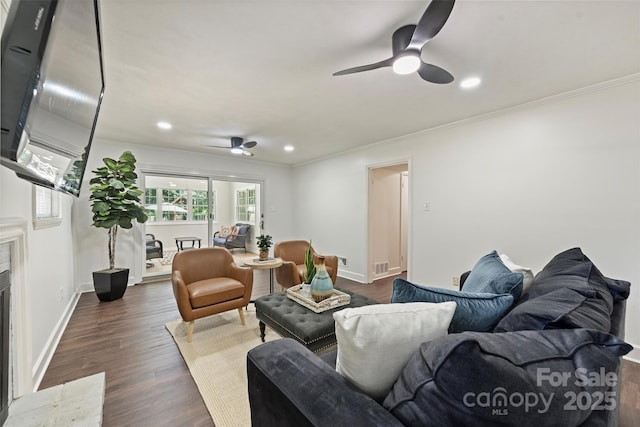 3165 Pendleton Ave, Charlotte, NC 28210 - living area with a ceiling fan, ornamental molding, dark wood-style flooring, recessed lighting, and a fireplace