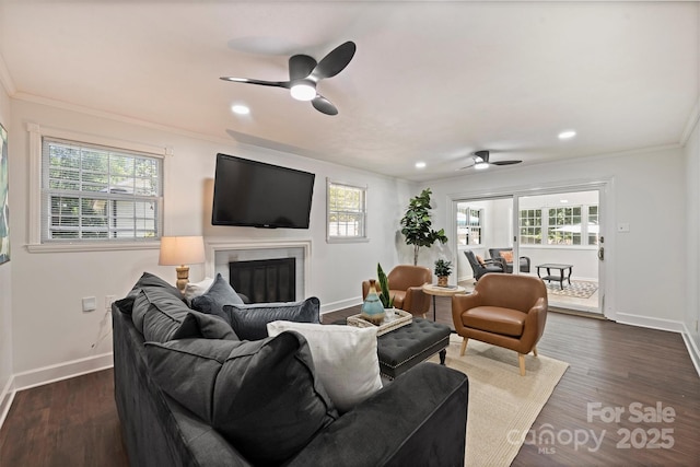 3165 Pendleton Ave, Charlotte, NC 28210 - living area featuring ceiling fan, crown molding, a glass covered fireplace, dark wood-type flooring, and recessed lighting