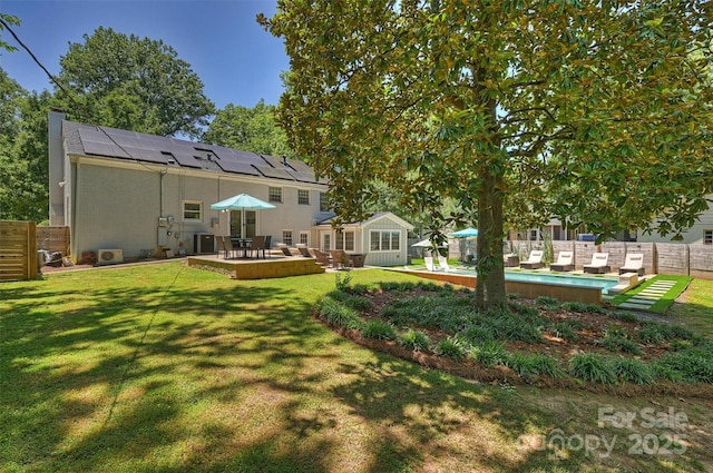 3165 Pendleton Ave, Charlotte, NC 28210 - back of property with roof mounted solar panels, a chimney, a patio area, and stucco siding